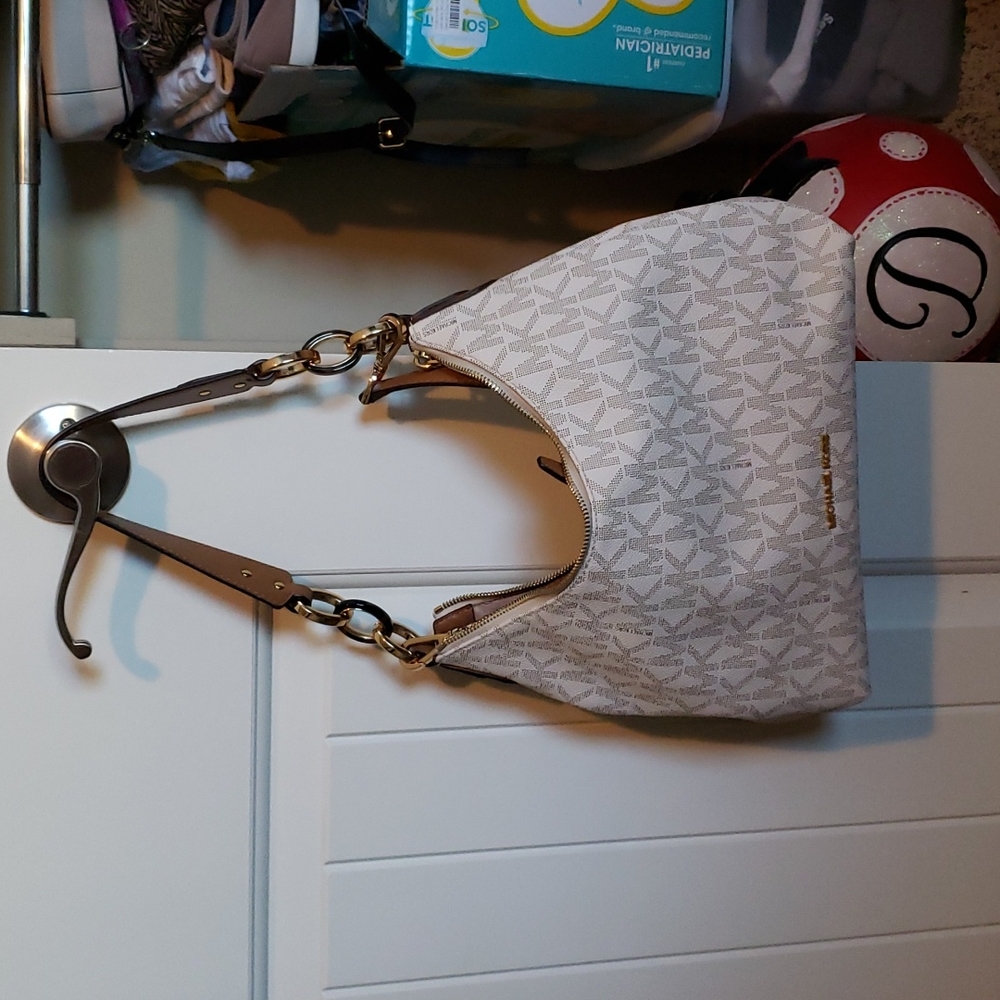 Michael kors handbag, like new has short handle as well as crossbody strap.